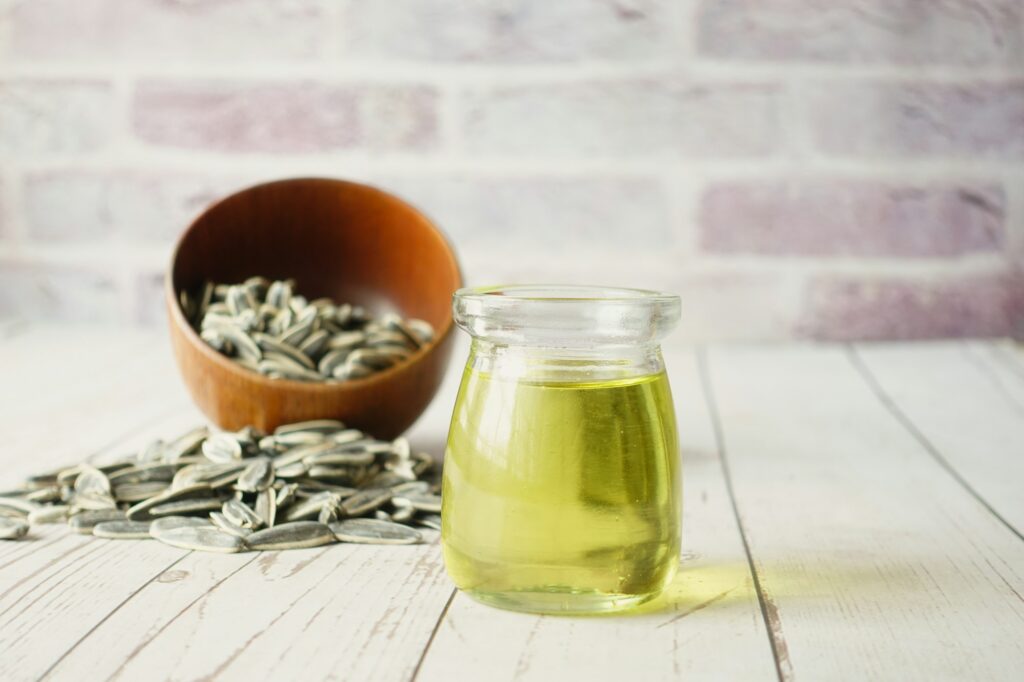 sunflower oil seed and oil in a container on table